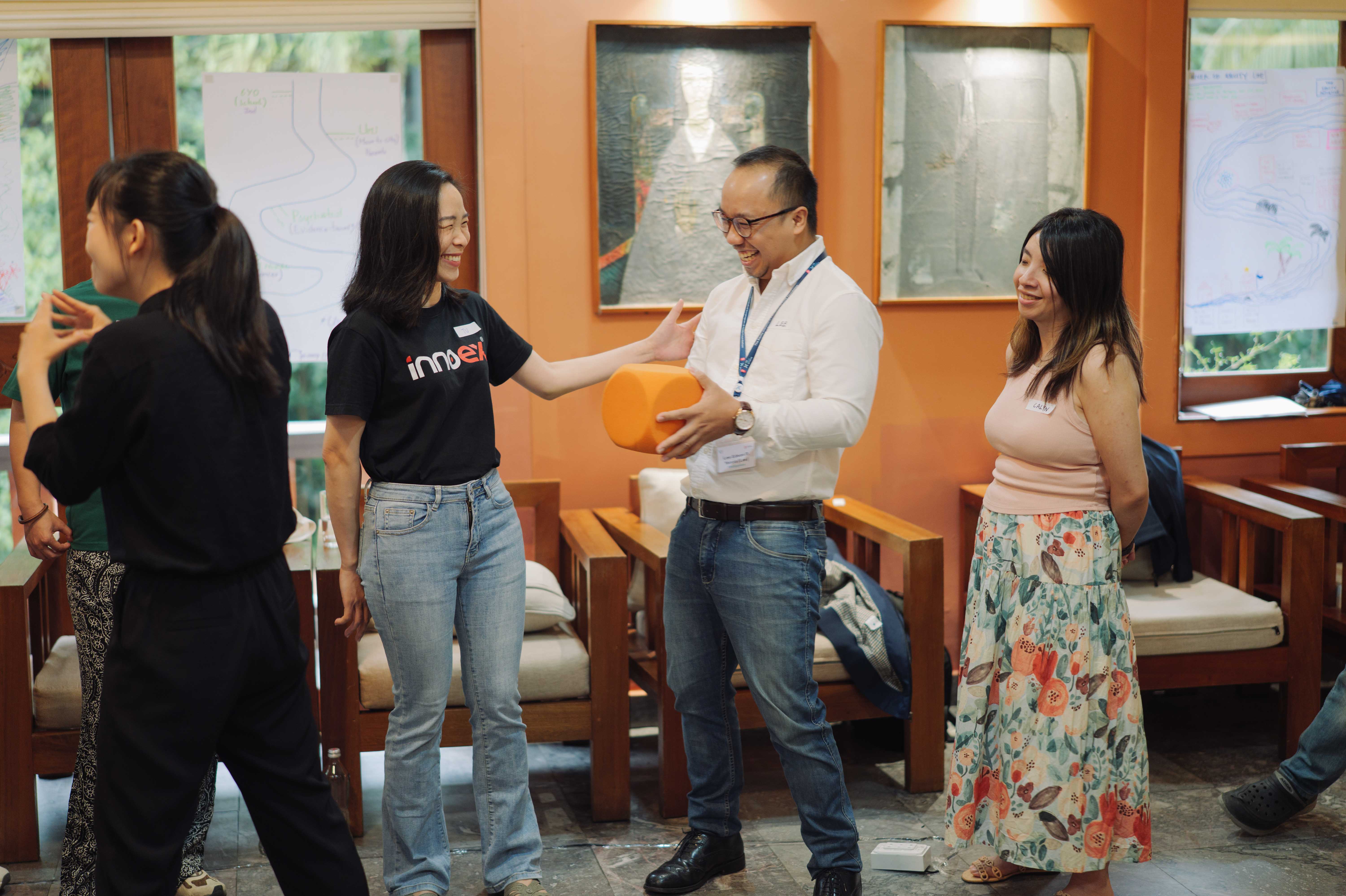 Lee Edson P. Yarcia (2026, Philippines) laughs with Bui Thi Thanh Tu (2026, Viet Nam) during Empathy Box.